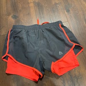Grey and salmon athletic shorts. Size Small
